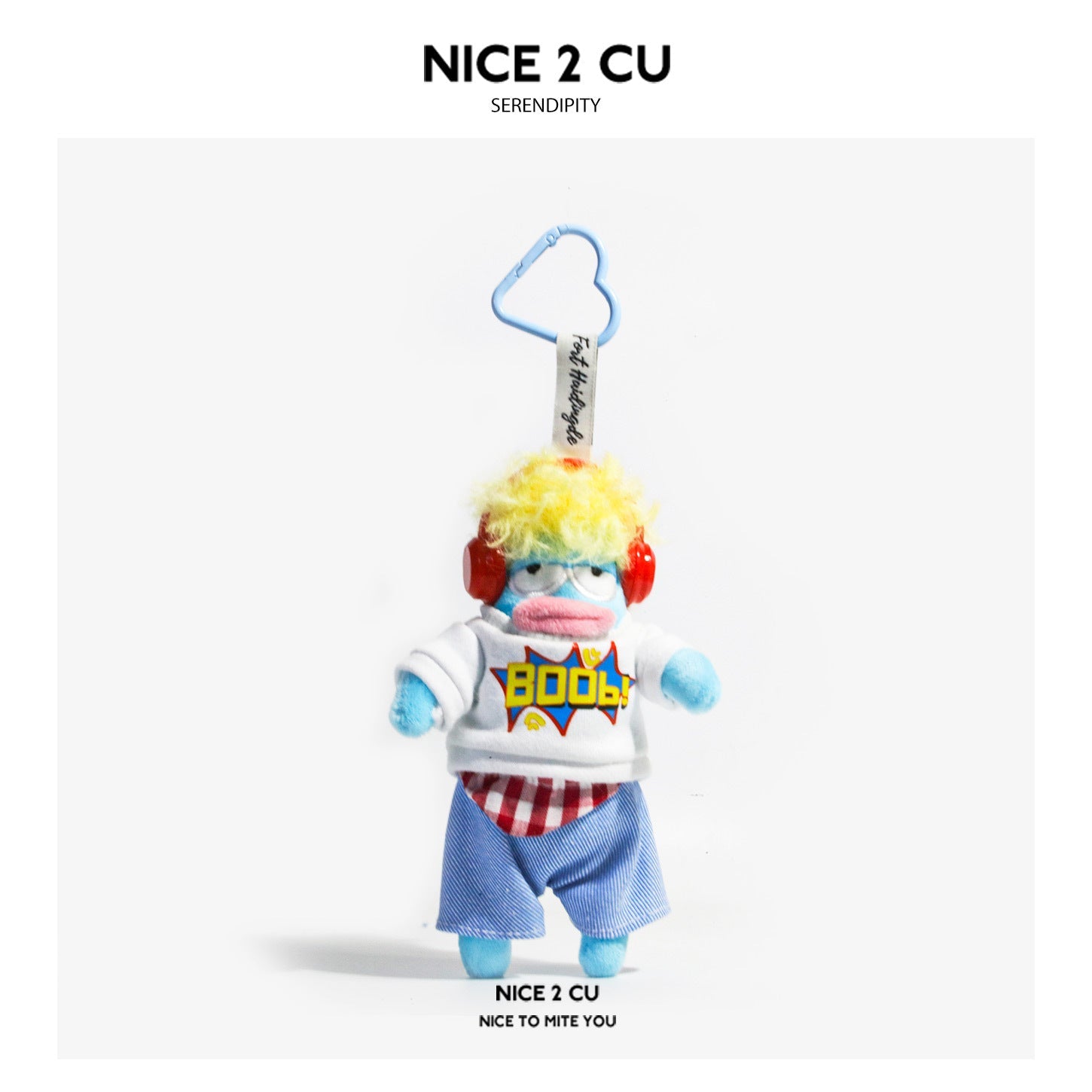 NICE 2 CU Serendipity plush character keychain with rainbow hair, red headphones, and comic-print white tee on light blue fig