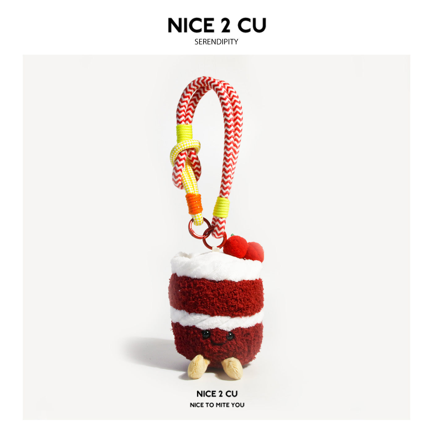 Red birthday cake plush bag charm with white frosting bands, cherry decorations, and braided rope loop