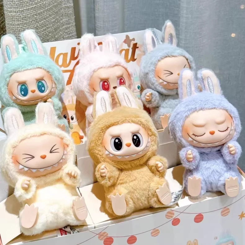 The POP MART Labubu Have a Seat Series – Complete 6-Piece Plush Keychain Set features expressive plush toys with bunny ears in assorted pastel colors, presented in a display box with no duplicates.