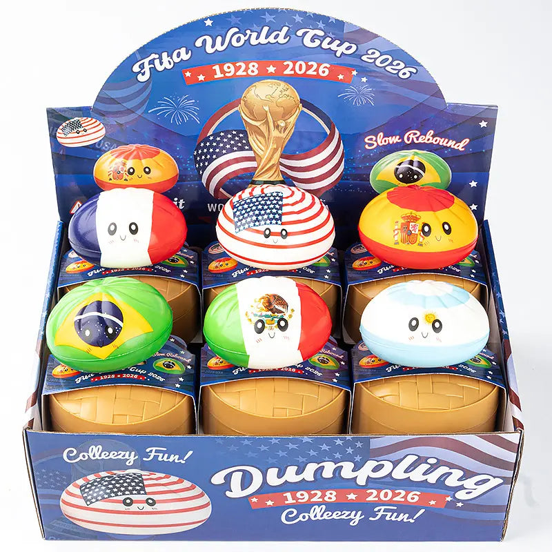 ZoDoll FIFA World Cup 2026 Squishy Dumpling Fidget Toy with Steamer features 6 country flag designs and cartoon faces in a green, soccer-striped display box, themed around the tournament and labeled Collezy Fun!.