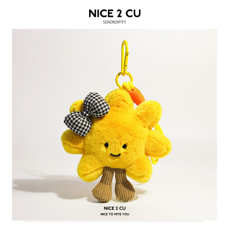 Yellow sunflower plush charm decorated with a black-and-white checkered bow and yellow strap