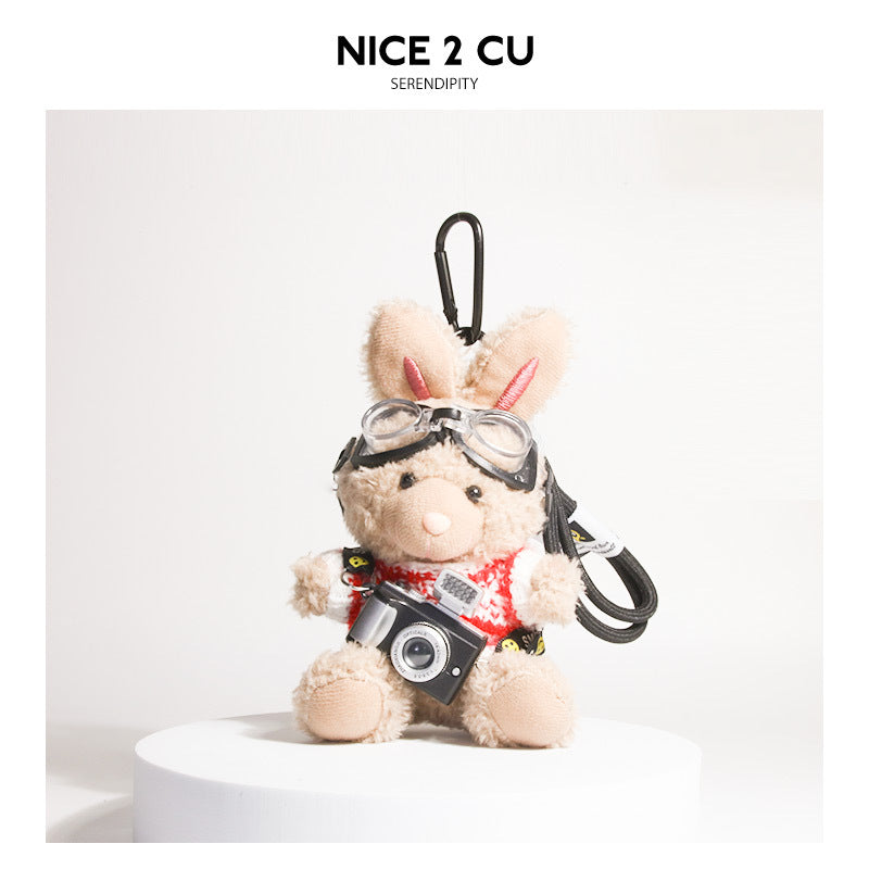 Brown plush rabbit keychain in red-and-white knit sweater with aviator goggles and camera charm