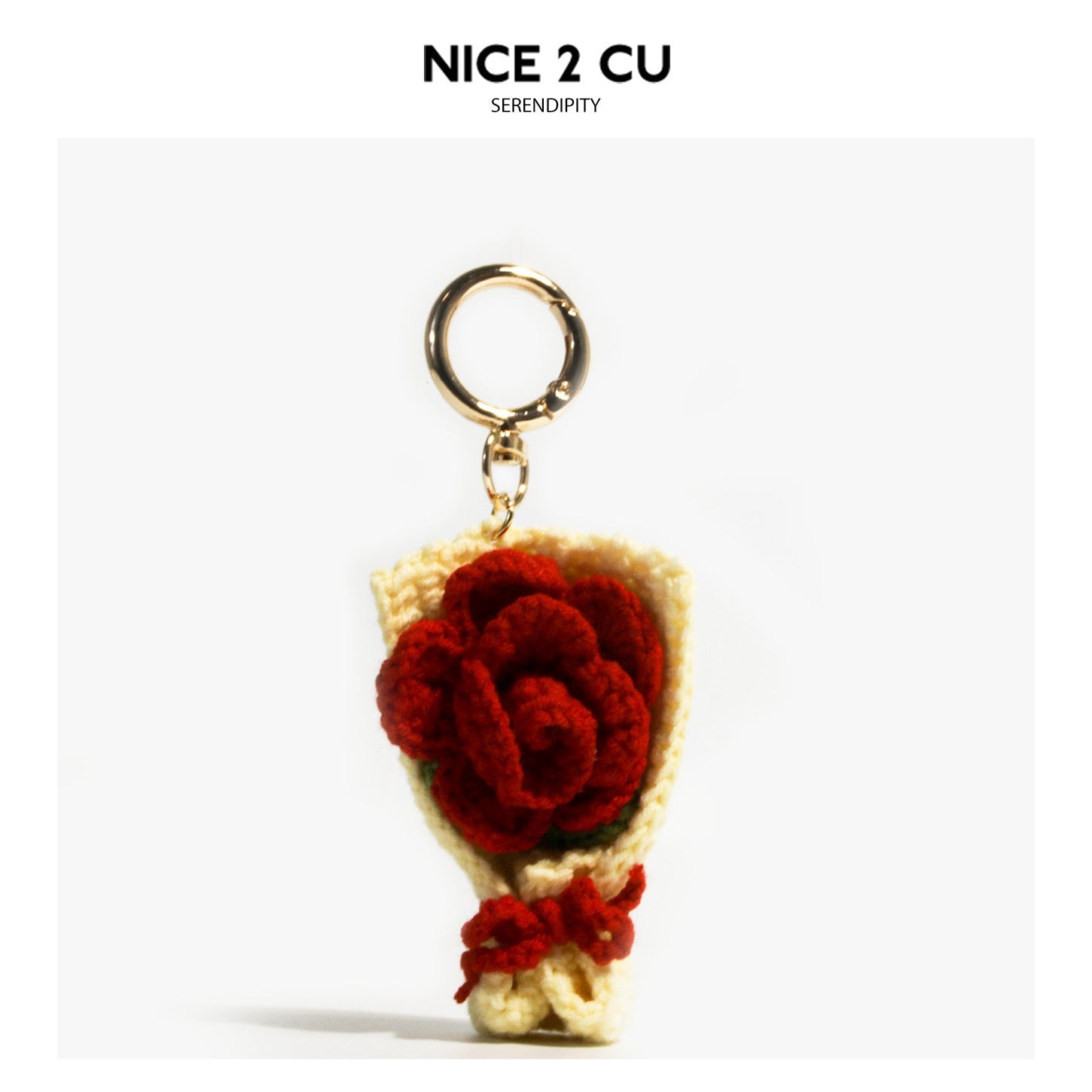 Miniature crochet red rose bouquet bag charm with cream cone, red bow, and gold-tone keyring