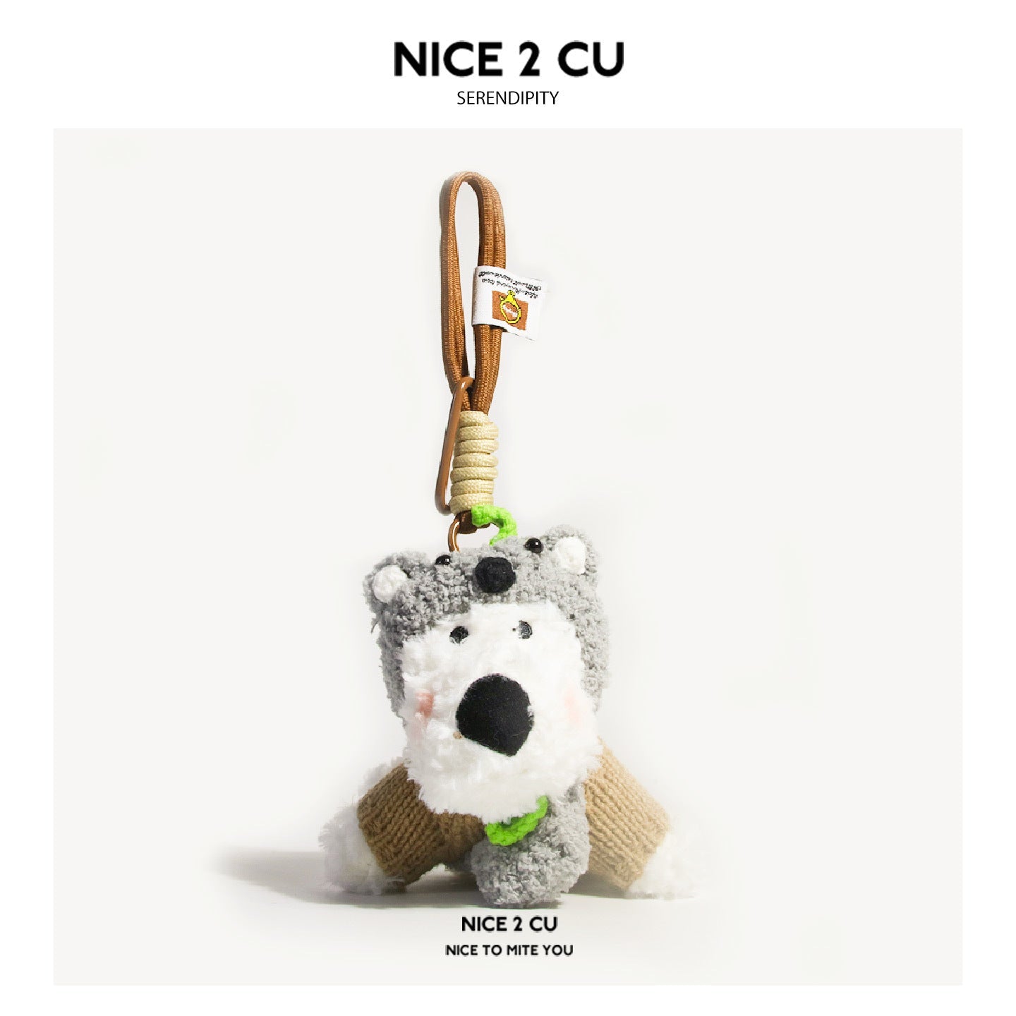 White dog plush keychain charm with gray koala hood and khaki knit sweater
