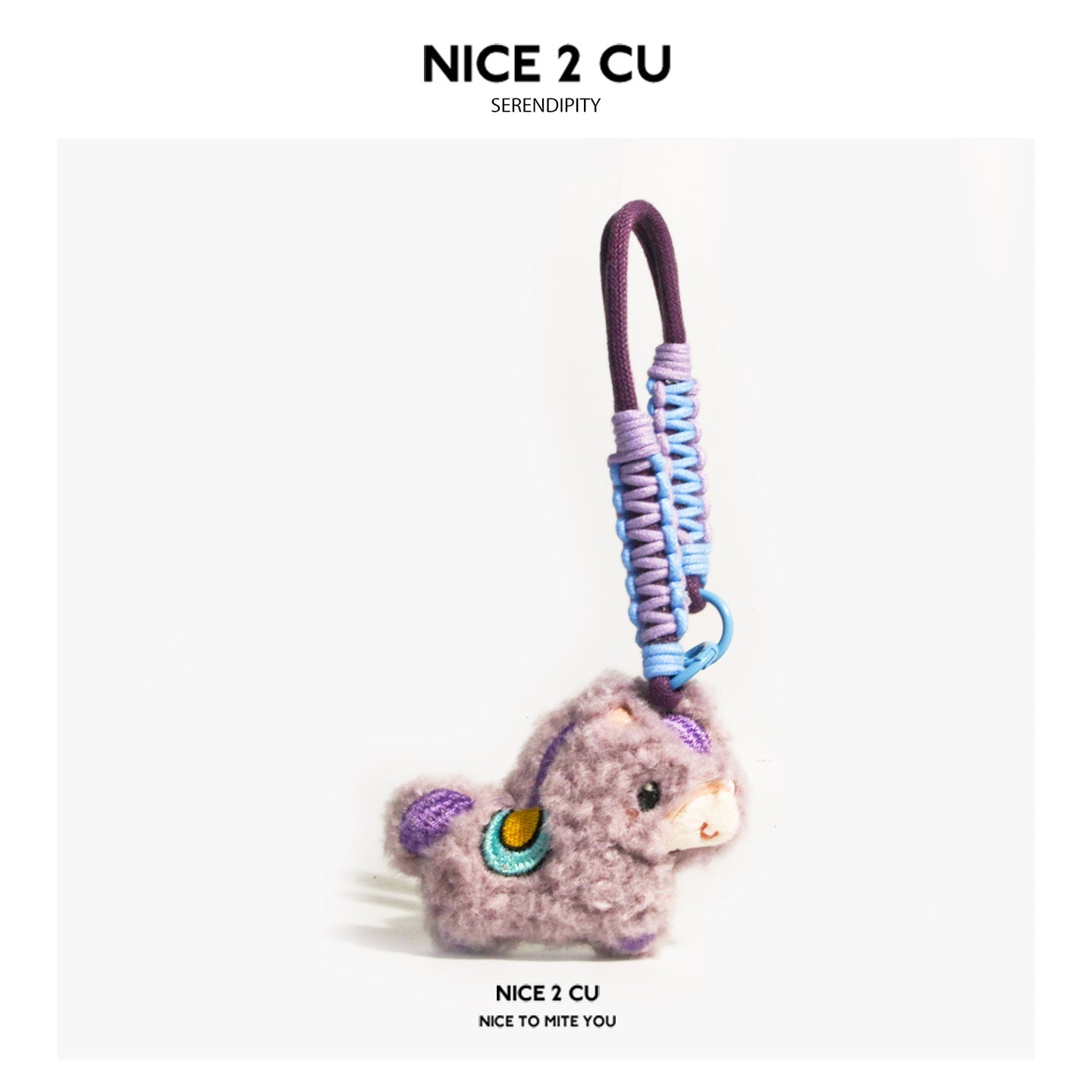 Mauve-purple bouclé plush horse charm with teal and gold embroidered eye and lavender braided cord loop