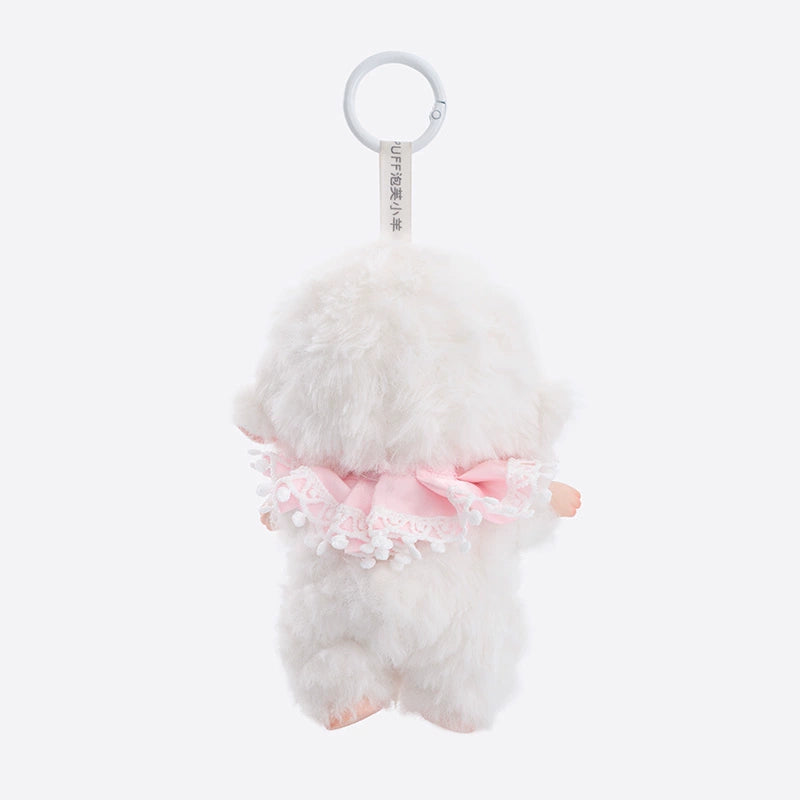 The ZEIO Sheep Plush Keychain is a 16cm soft, fuzzy lamb doll with a bow and clip, shown from the back in a pink lace-trimmed outfit against a plain light background—ideal as a cute backpack charm.