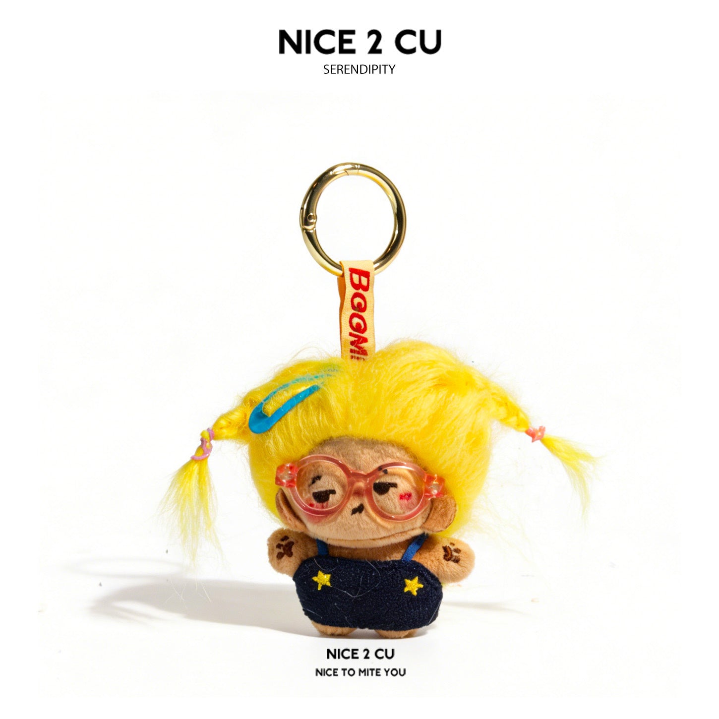 Yellow-haired plush doll keychain charm with pink glasses and dark blue star-detail overalls on gold ring