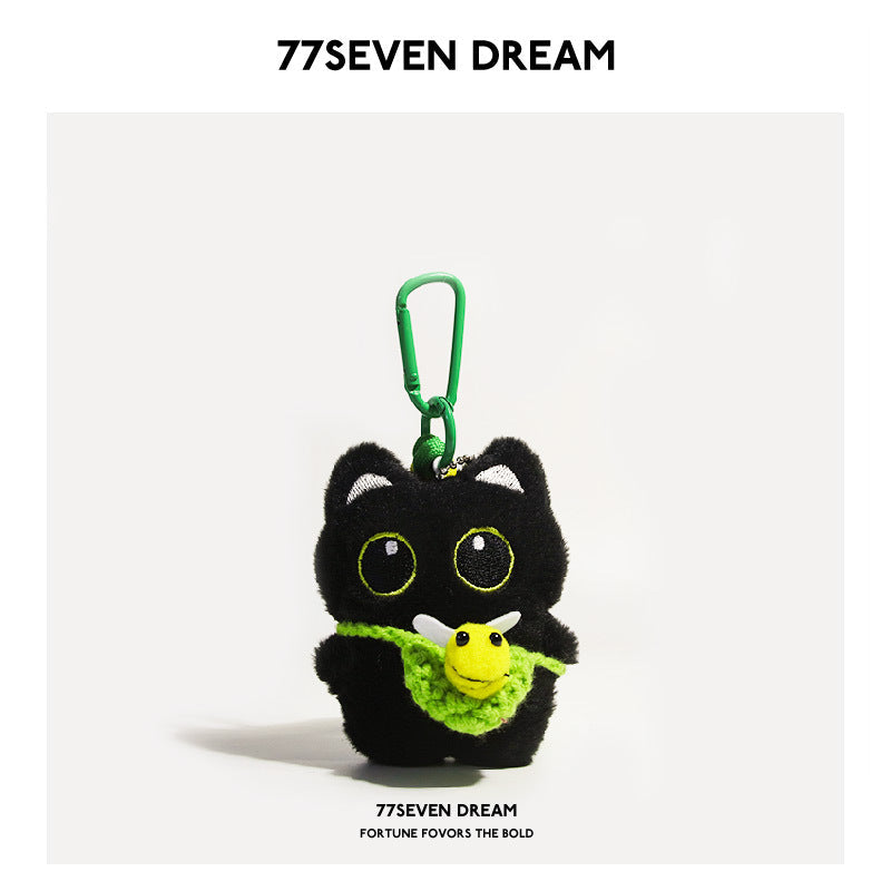 Black cat plush charm with green accents, green crocheted bee-front panel, and small yellow bee motif