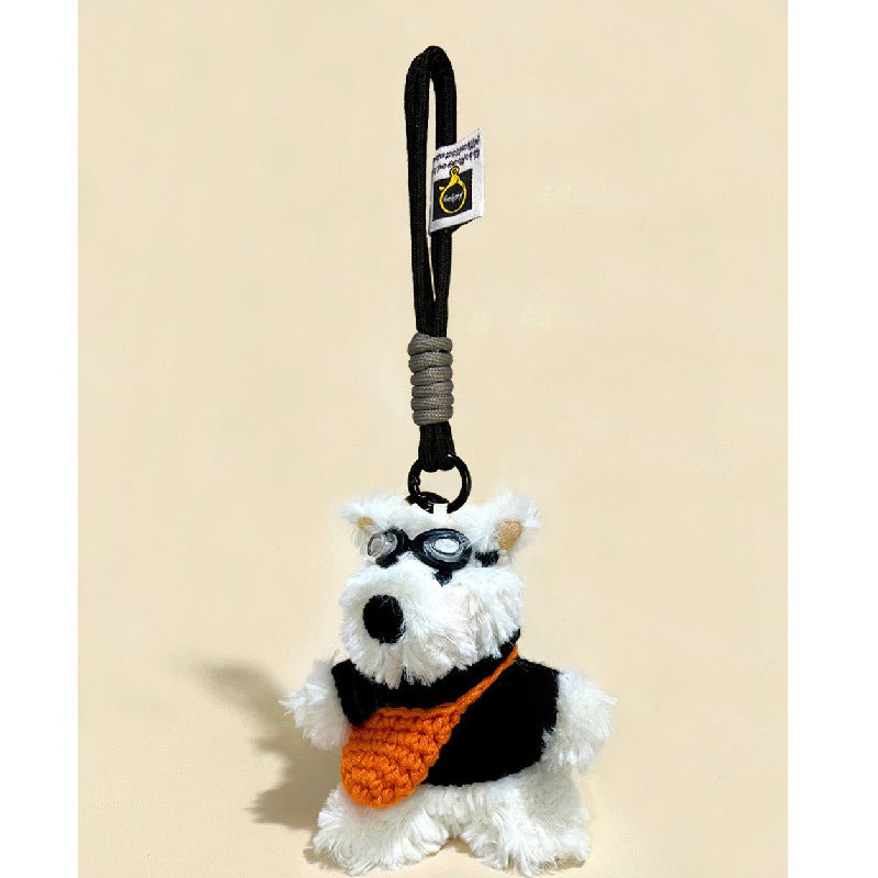 Standing Westie plush keychain charm with black goggles and orange front garment on black hanging cord