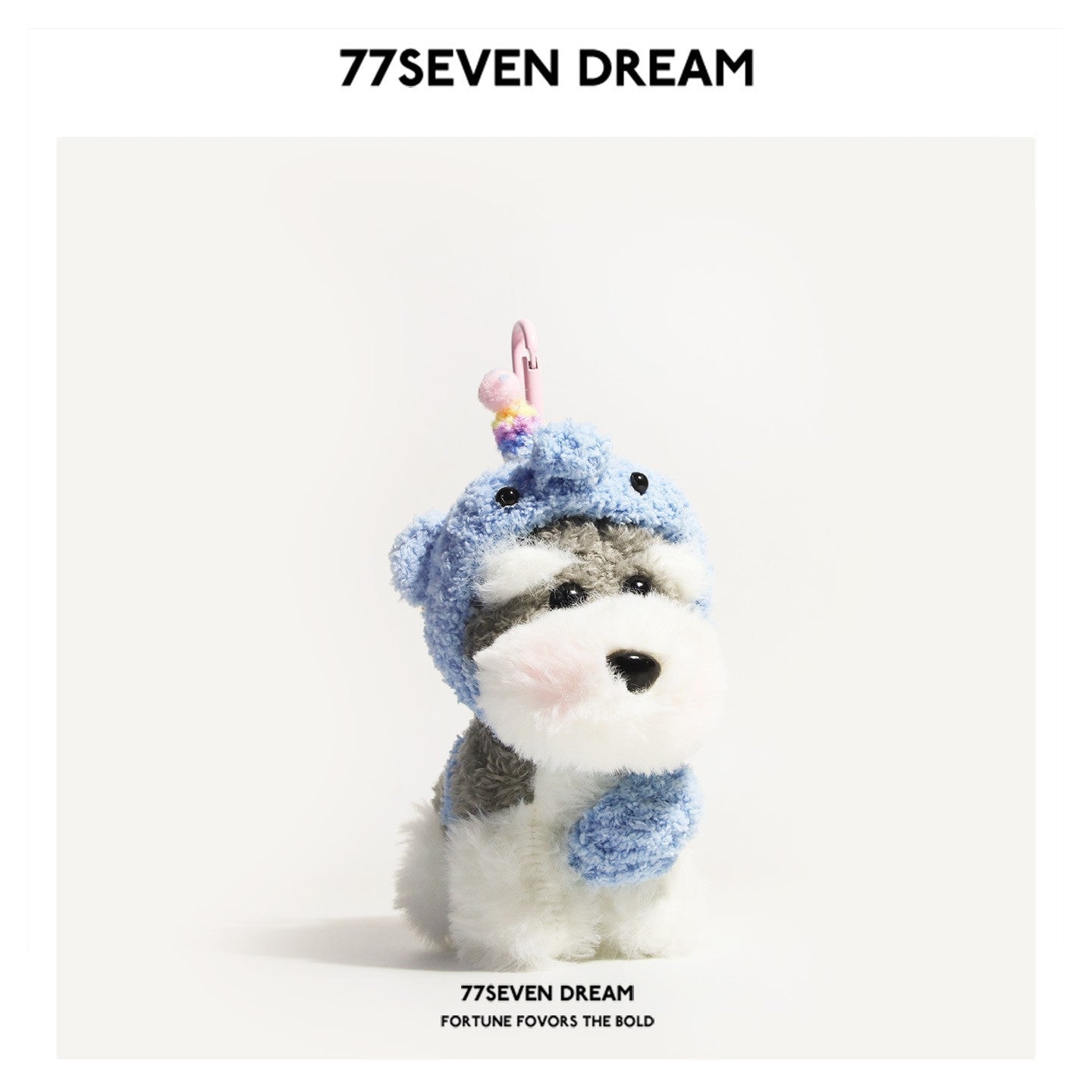 Schnauzer plush bag charm dressed in a light blue elephant-themed hood with rounded ear shapes