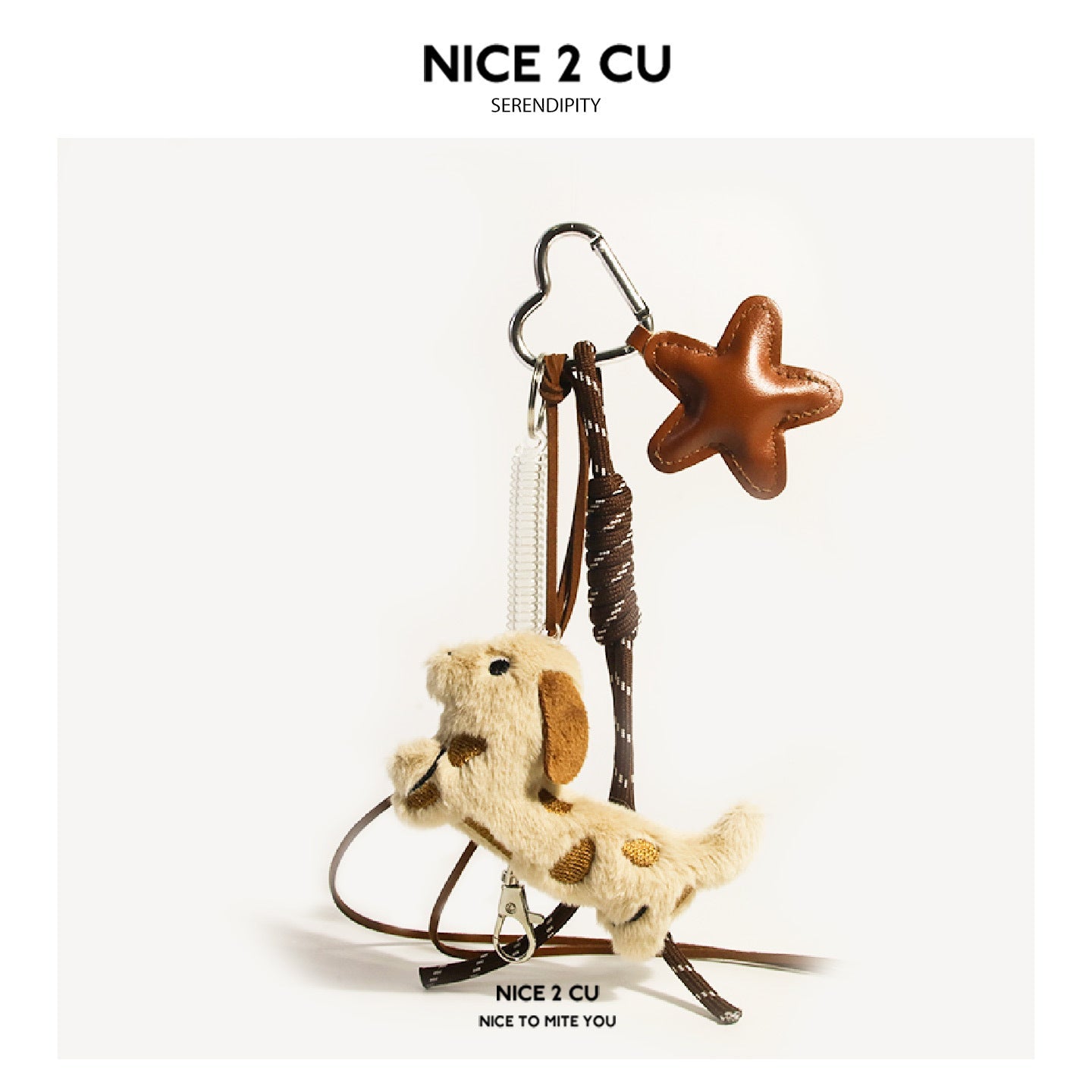 Cream spotted plush dog with brown ears and single brown leather-look star charm on braided brown cords with silver heart cla