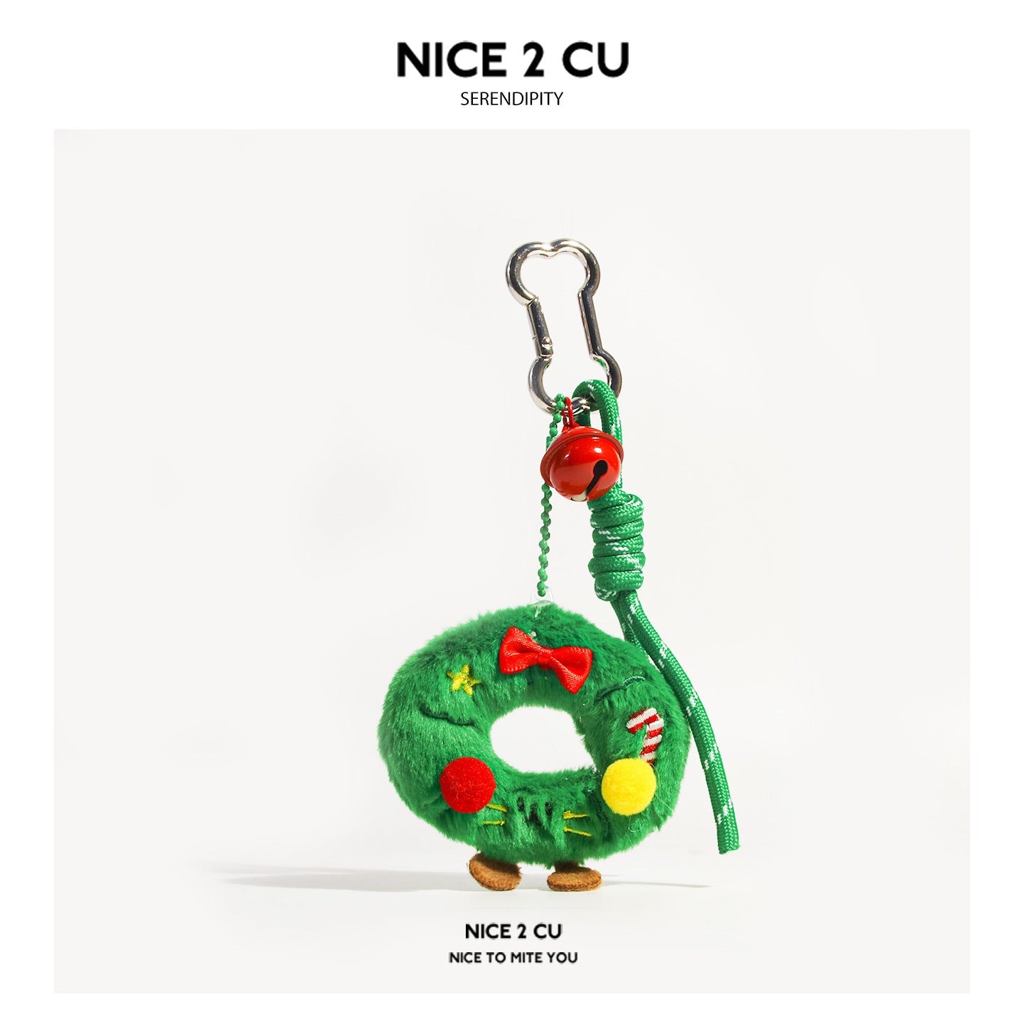 Green fluffy Christmas wreath plush keychain charm with red bow, pom-poms, tiny legs, and silver carabiner clip