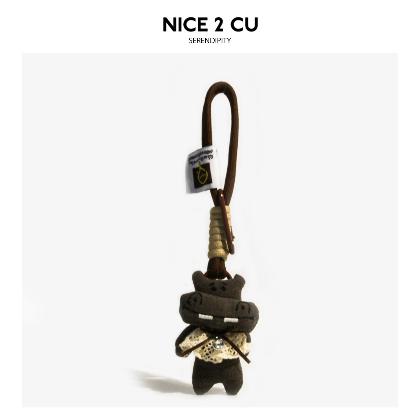 Dark-brown kawaii hippo plush charm with lace collar, stitched teeth, and braided cord clip