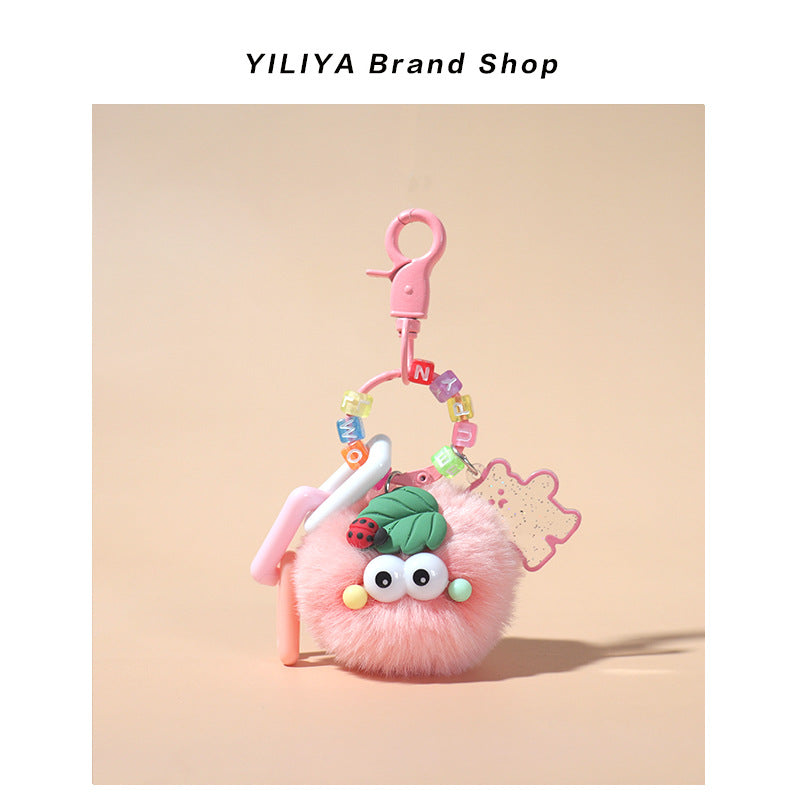 Pink fluffy pom-pom charm with pink small clip hardware, pastel translucent beads, plastic ring pieces, and ladybug leaf deco