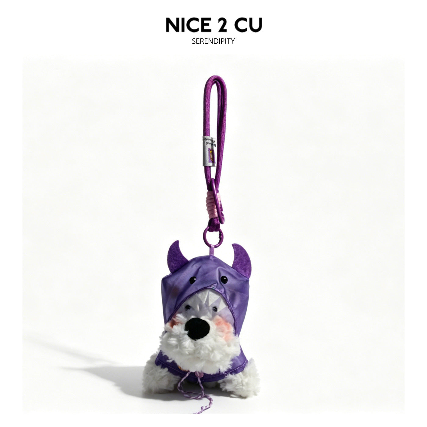 Soft white dog plush bag charm in a purple hooded raincoat with horn-like top accents