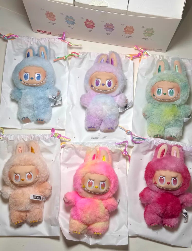 The POP MART Labubu “Big Into Energy” 6‑Piece Plush Keychain Set features pastel plush dolls—Love, Happiness, Loyalty, Serenity, Hope & Luck—with big eyes and bunny ears on white drawstring bags for collectors.