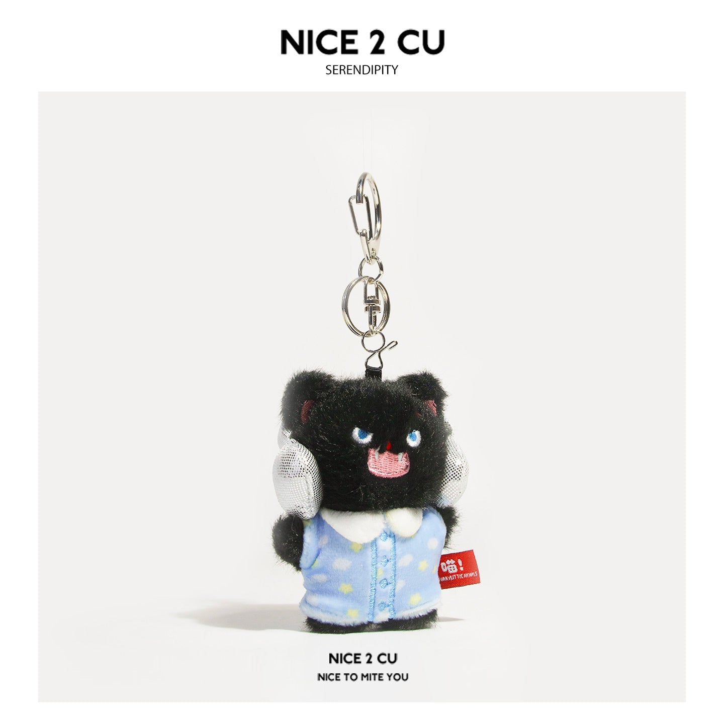 Black fluffy cat plush keychain wearing light blue star-print pajamas with silver lobster-claw clasp