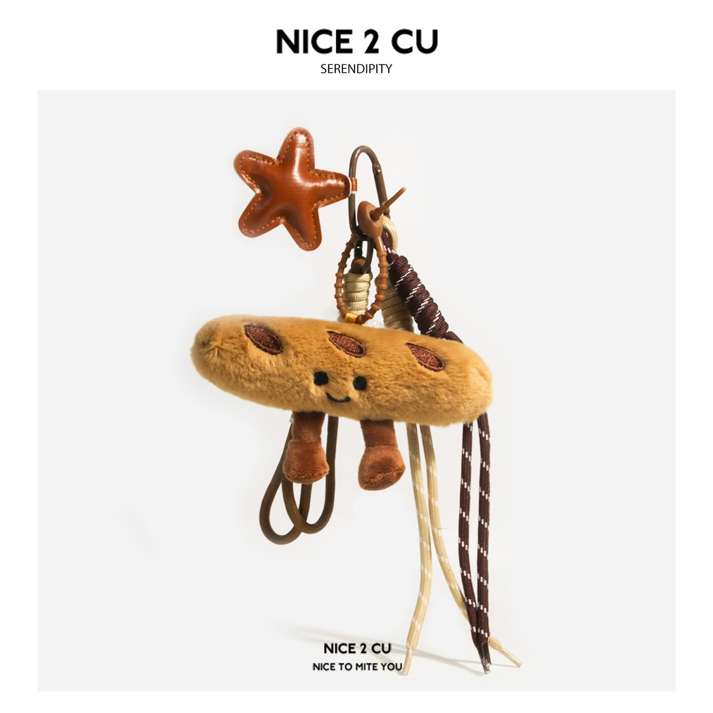 Brown baguette plush keychain charm with smiley face, star-shaped hard accent charm, and multiple braided cord tassels