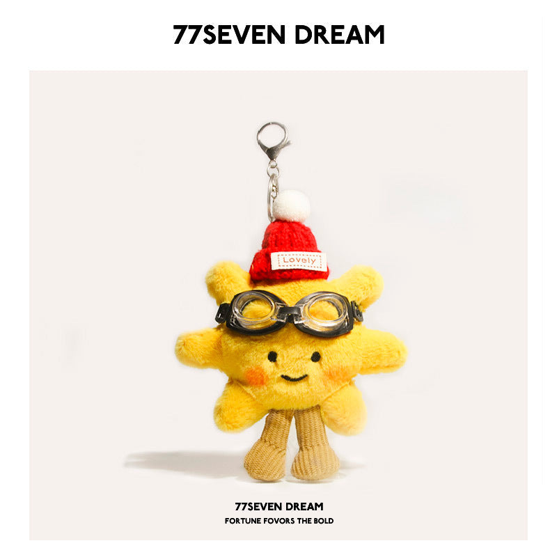 Yellow sunflower plush charm with red knit hat and black toy goggles