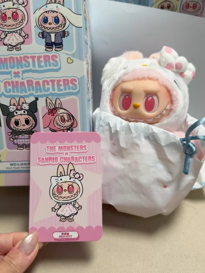 The POP MART LABUBU Hello Kitty and Friends Series Hello Kitty Plush Pendant Figure features a collectible doll in a white bunny costume with pink accents, partially wrapped in paper, alongside a character card and themed box—ideal for kawaii fans.
