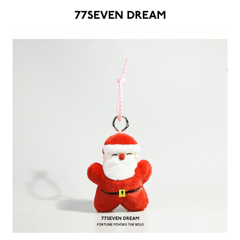 Red and white Santa Claus plush charm keychain with white beard, black belt, yellow buckle, and pink hanging strap