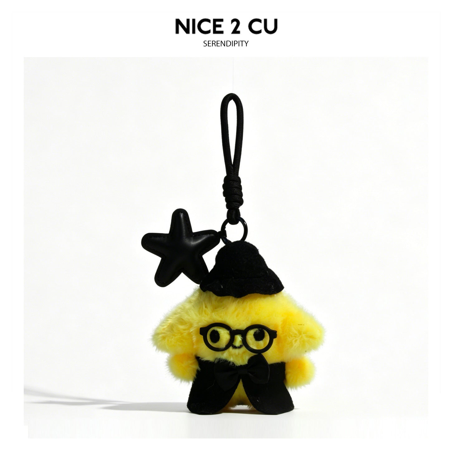 Yellow fluffy witch plush charm with black hat, round glasses, cape, and black star pendant on braided cord loop