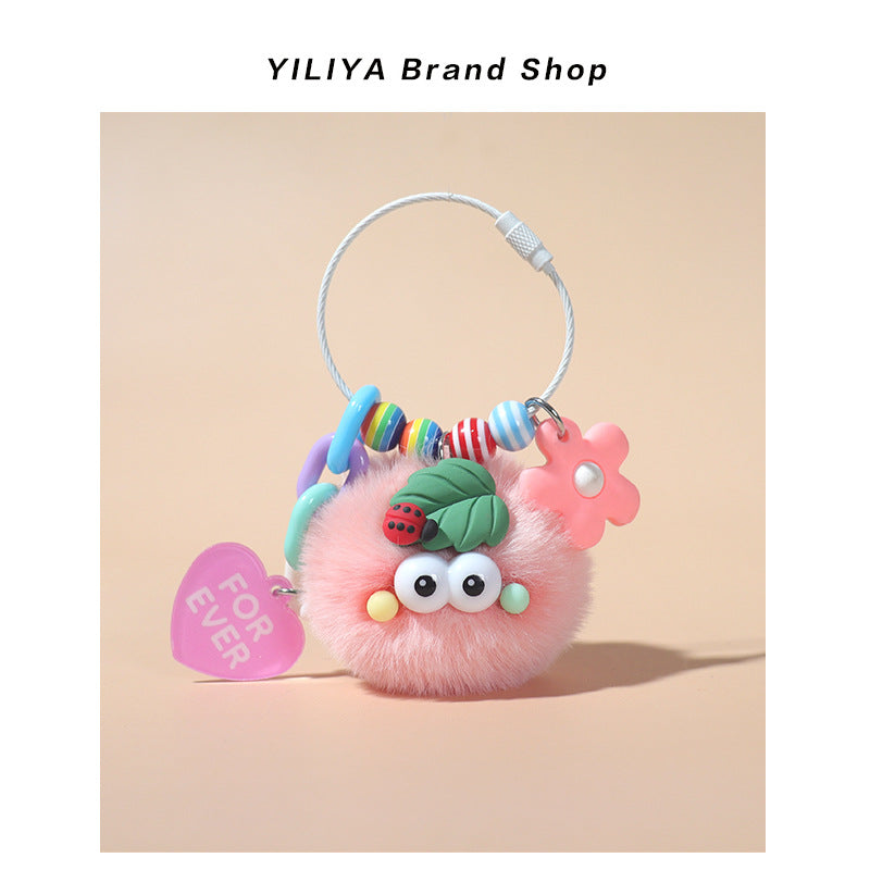 Pink fluffy pom-pom keychain charm with rainbow striped beads, ladybug leaf topper, and pink FOR EVER heart tag on large roun