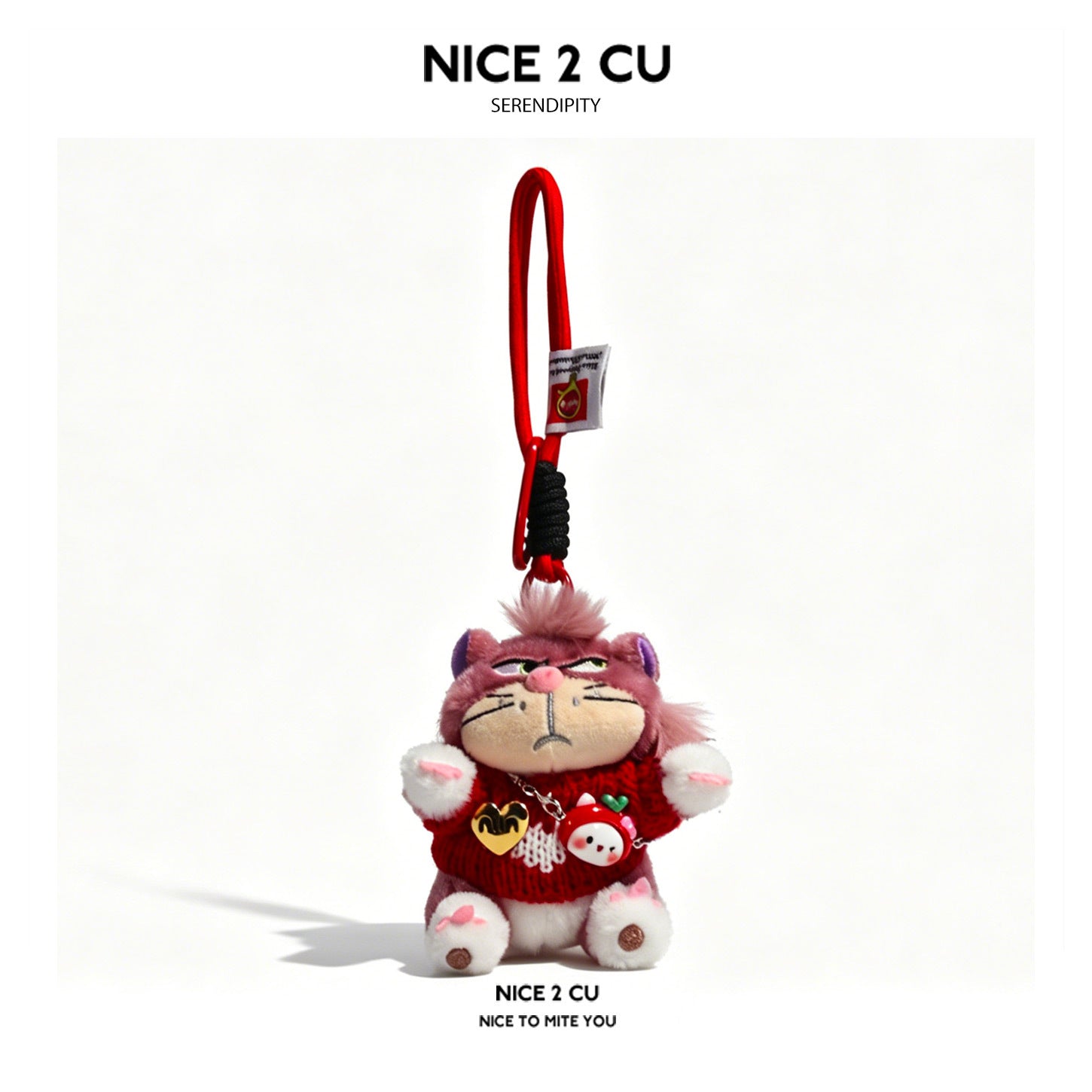 Mauve cat plush keychain wearing a red sweater with small dangling chain and charm details