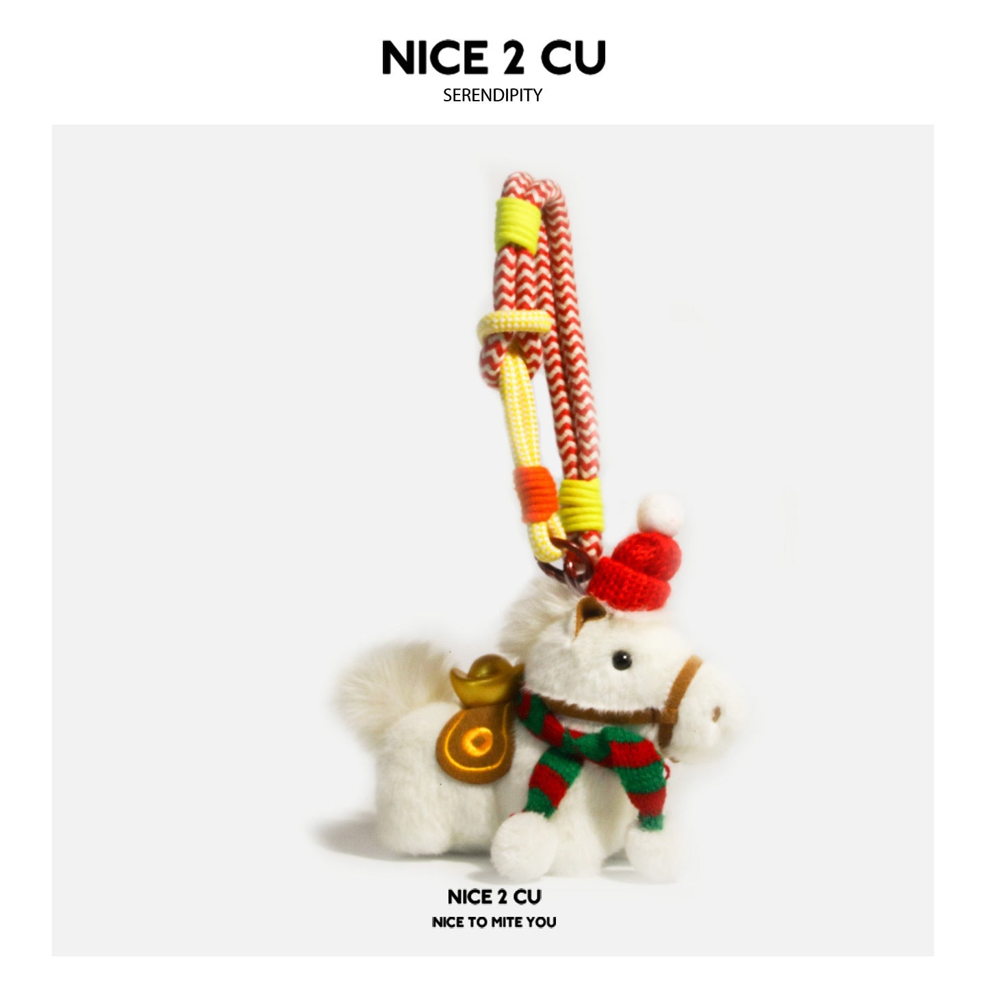 White plush horse ornament with red-and-green striped scarf, red hat, and hanging cord attachment