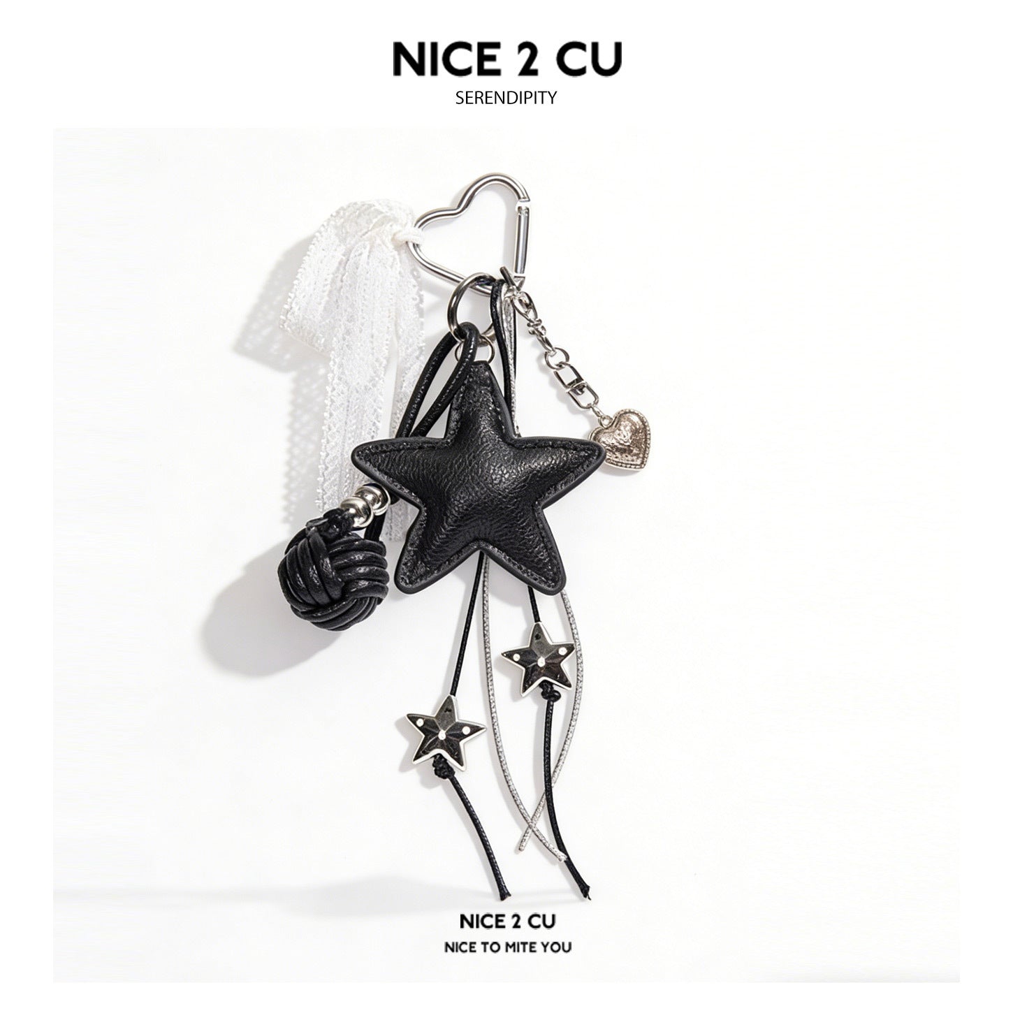 Black faux-leather star bag charm keychain with silver heart carabiner, lace ribbon, and dangling star bead cords