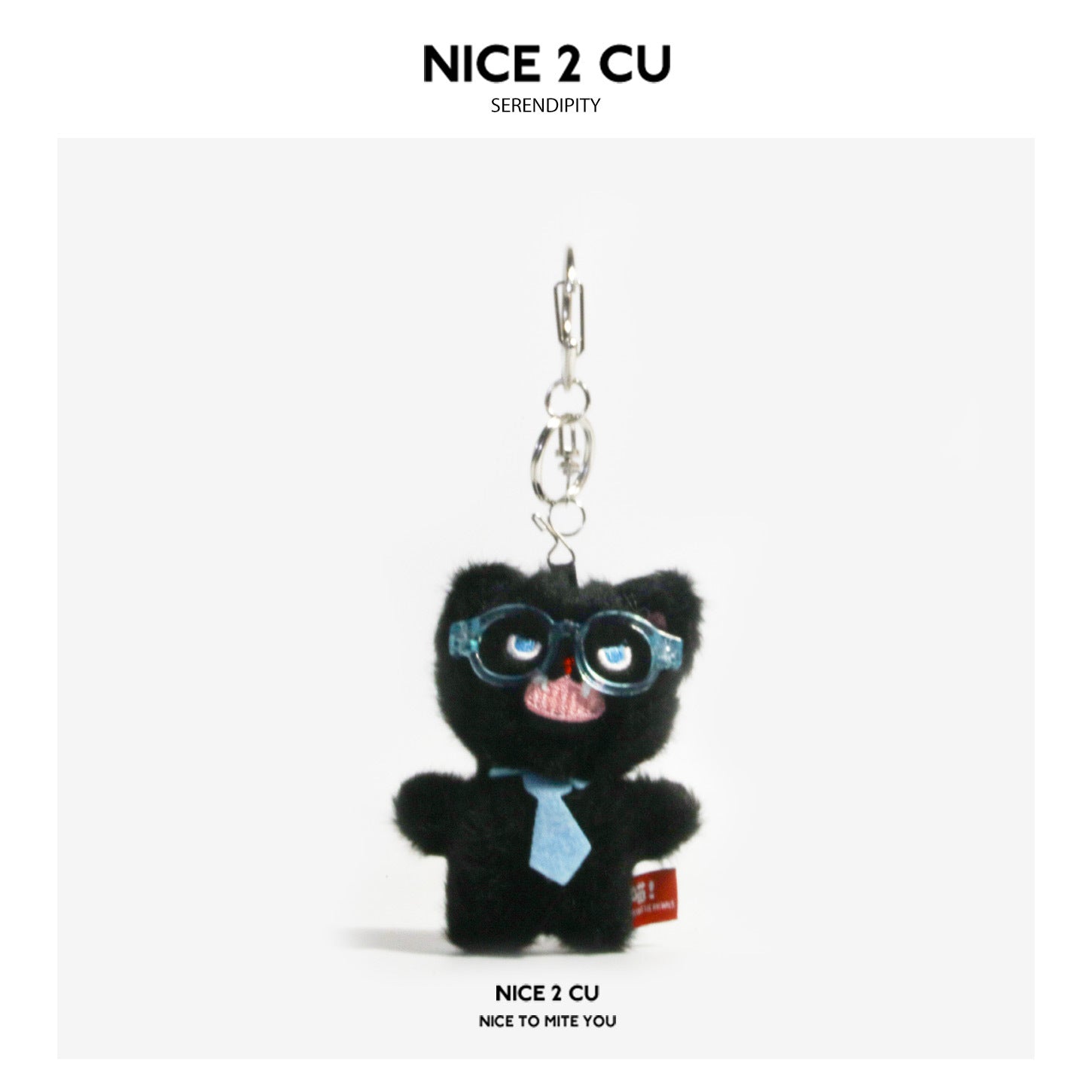 Black fluffy plush cat keychain charm wearing blue round glasses and a blue necktie, with silver metal keyring