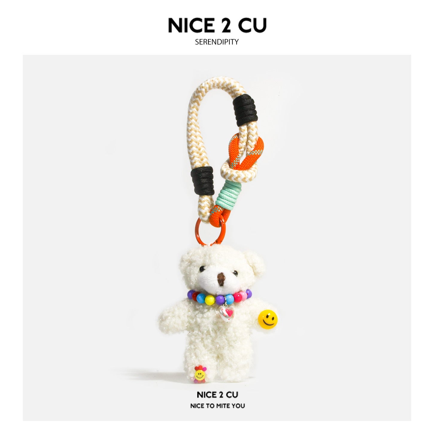 White plush teddy bear bag charm with rainbow bead necklace, heart pendant, smiley charm, and braided cord strap with orange 