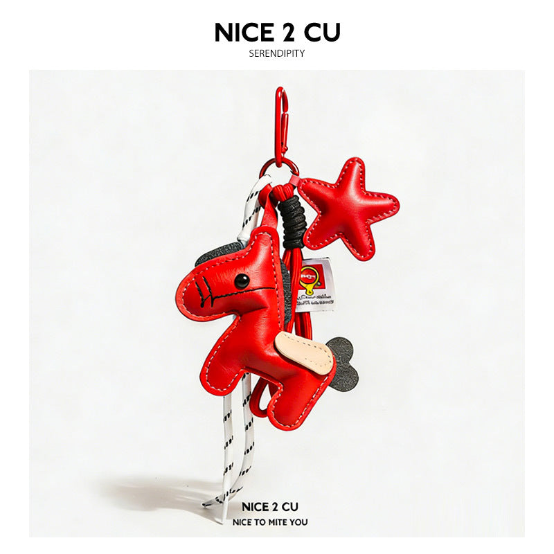 Red leather-look pony and star charm keychain with black bead eye and braided cord