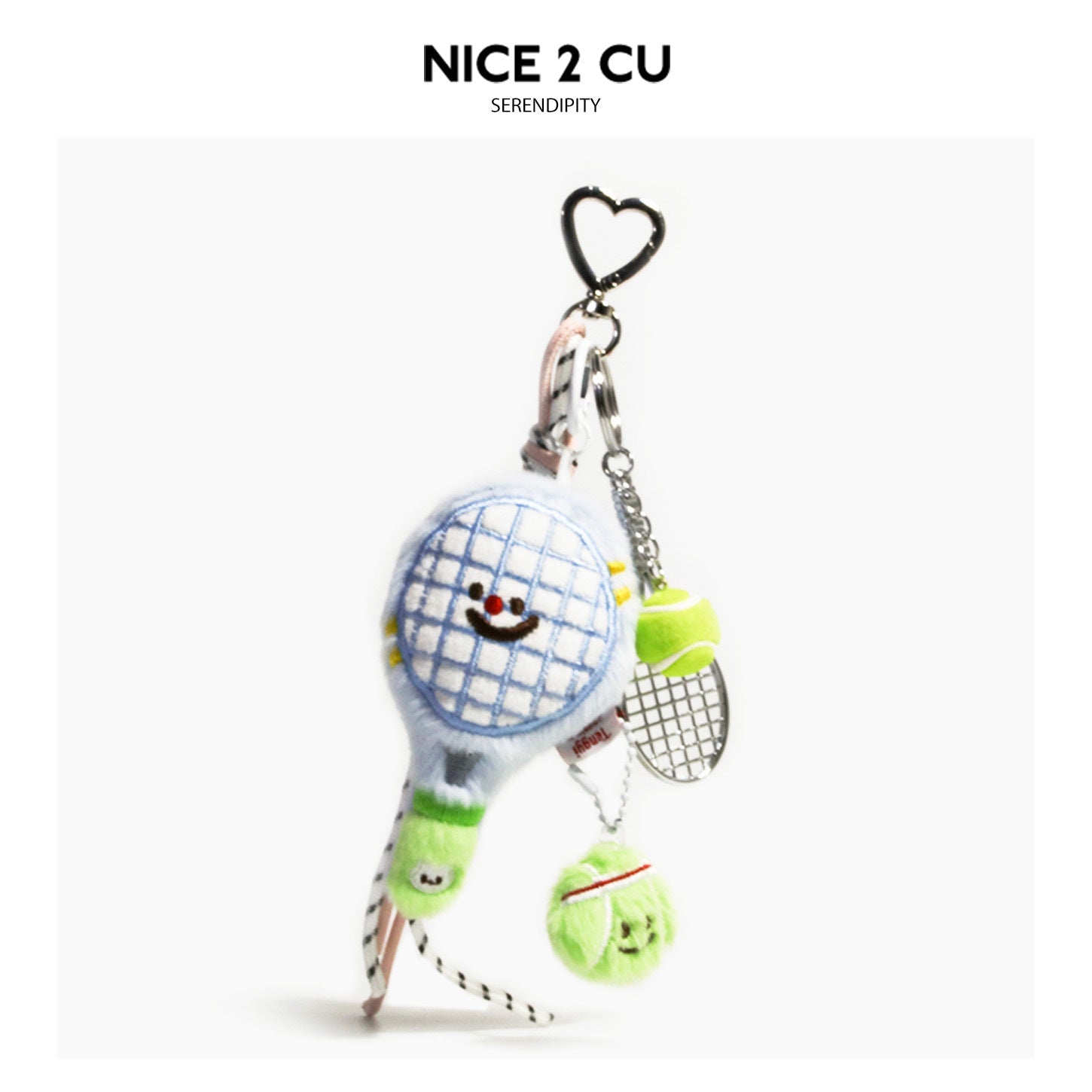 Light blue kawaii tennis racket plush keychain with embroidered smiley face, neon green tennis ball charm, and silver heart c