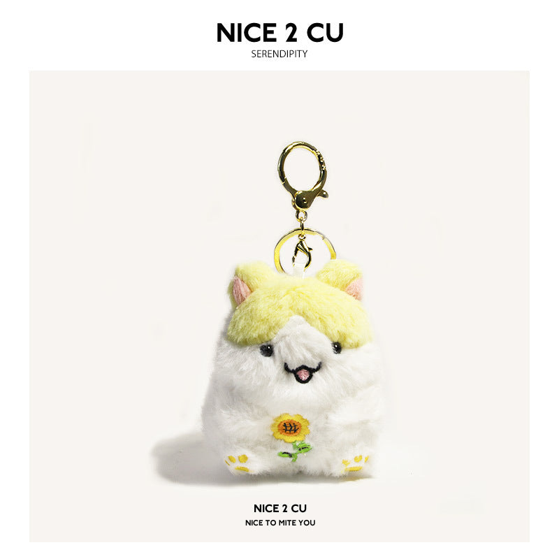 Kawaii white plush hamster keychain charm with yellow star hat and embroidered sunflower on chest, gold lobster clasp