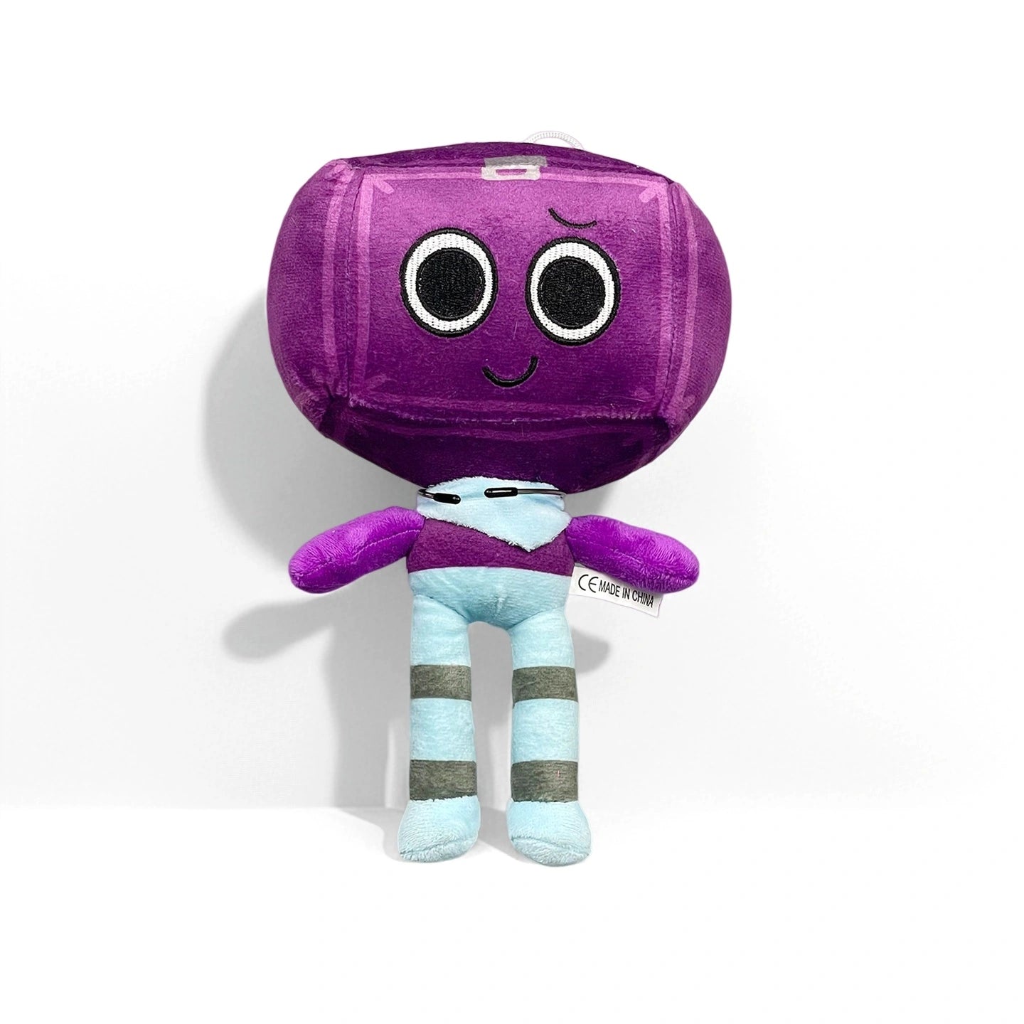 A purple character from the Dandy's World Plush Collection by Dandy's World, featuring a large square head, smiling face, light blue body, and striped legs, stands against a white background. Each soft stuffed toy is sold individually.
