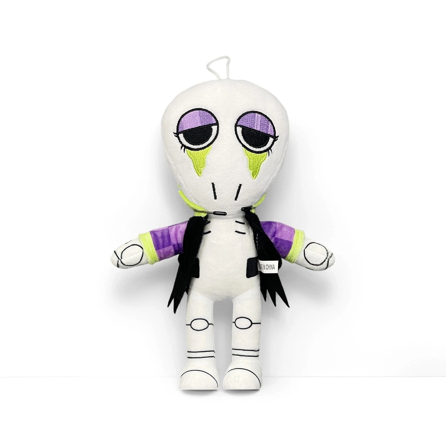 From Dandy's World Plush Collection, this soft stuffed toy features a white body, large purple eyes with green tears, black stitched mouth, and a black and purple jacket—sold individually by Dandy's World. Perfect for collectible plush fans.