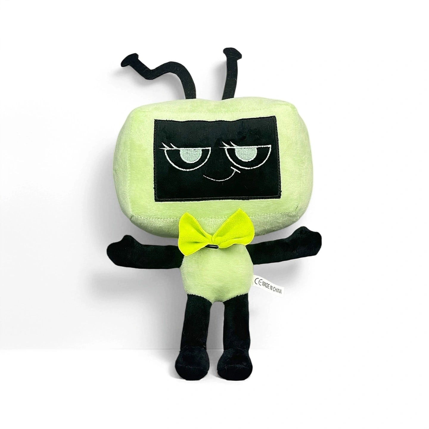 Dandy's World Plush Collection – Soft stuffed toy with a rectangular green face, screen-like eyes, black limbs, antennae, and a yellow bow tie. Each plush collectible is sold individually by Dandy's World.