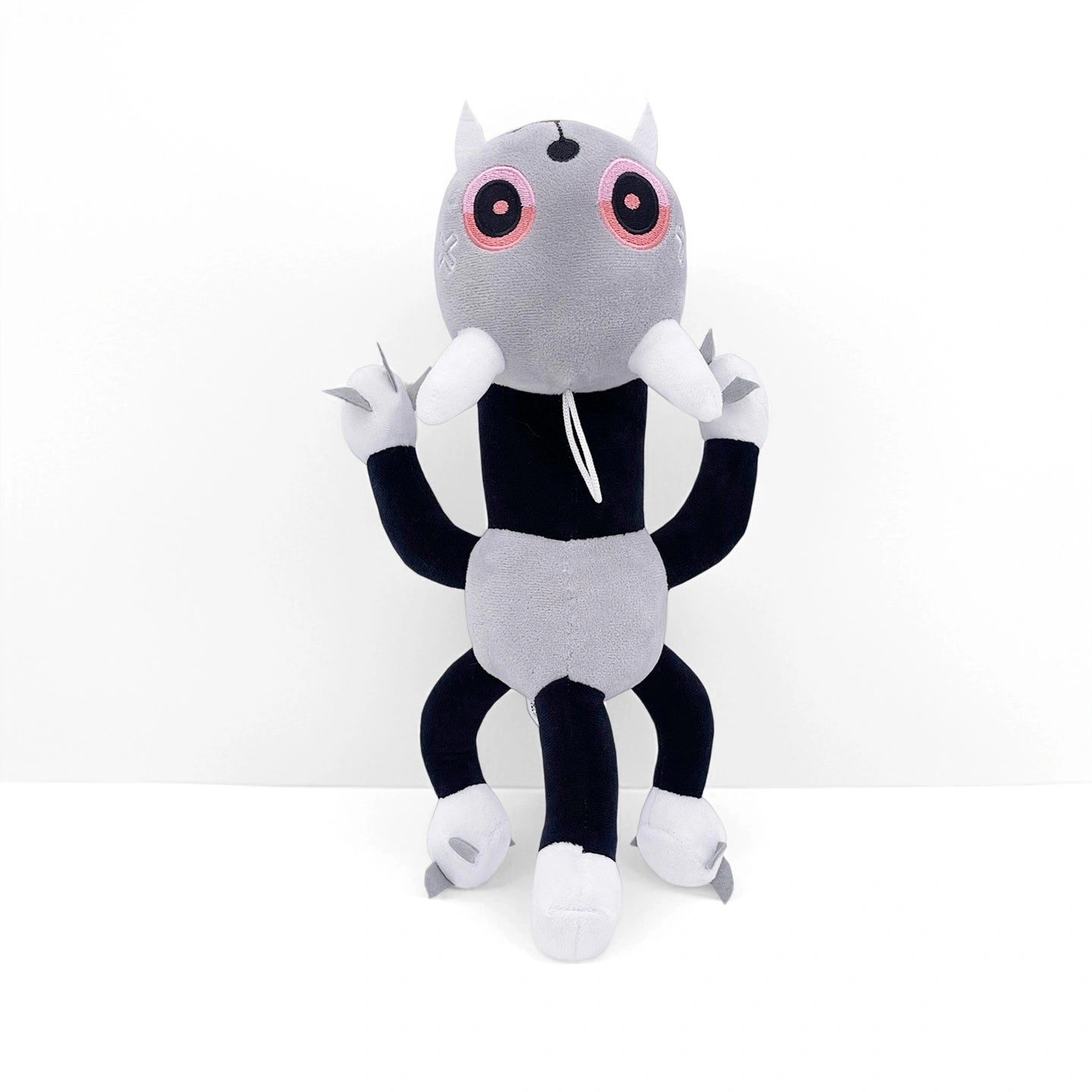 From the Dandy's World Plush Collection, this grey and black spider-like plush features pink embroidered eyes, horns, extra limbs, and white clawed feet—a must-have collectible for fans. Sold individually by Dandy's World.