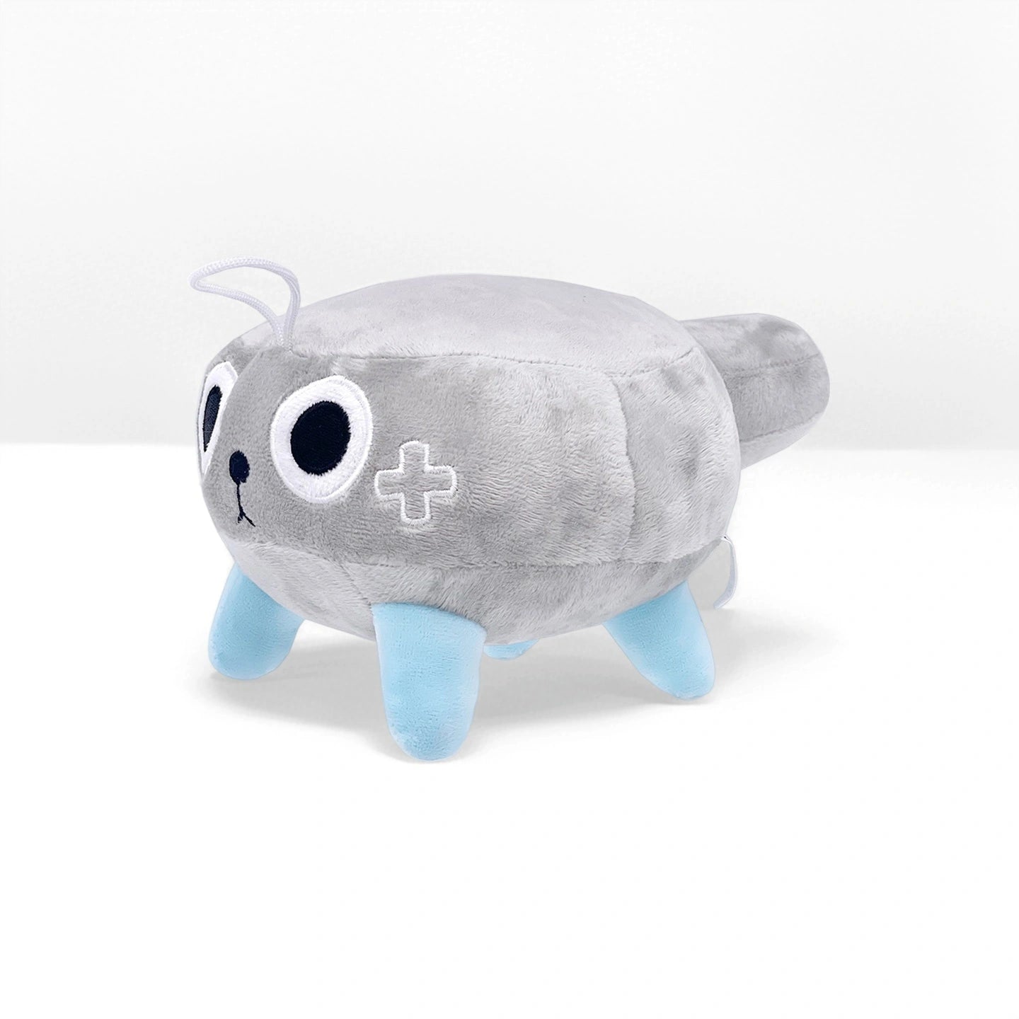 The Dandy's World Plush Collection features a gray and blue cat-shaped soft toy with large round eyes, a cross patch, and four legs. Sold individually, these charming plushies from Dandy's World make a delightful addition to any collection.