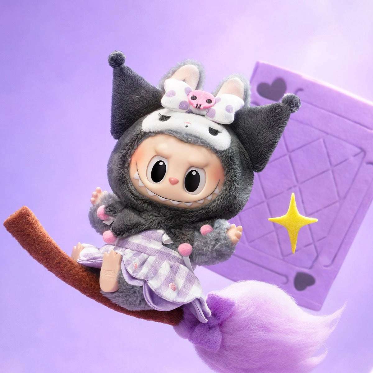 The POP MART LABUBU Hello Kitty and Friends Series Kuromi Plush Pendant Figure features Kuromi in a fuzzy gray animal outfit with a bow, riding a purple broomstick against a pastel background—a cute kawaii accessory.