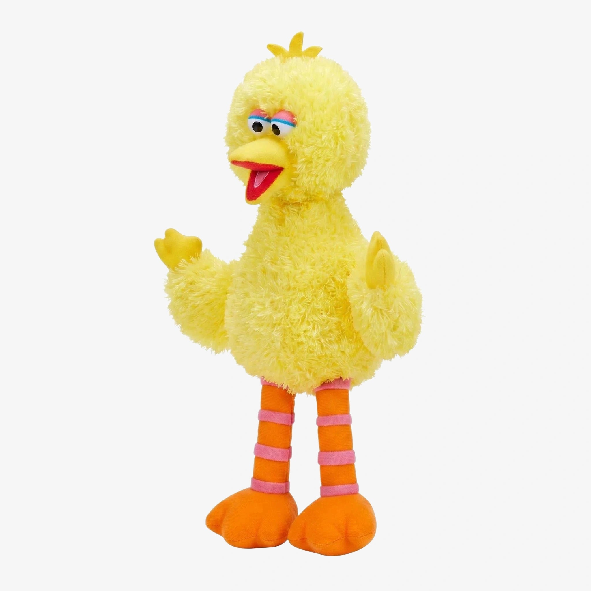 A yellow, fluffy bird-like puppet with orange legs and an open beak stands upright—resembling the ZoDoll Sesame Street Big Bird Plush, a 14-inch stuffed animal for kids and collectors.