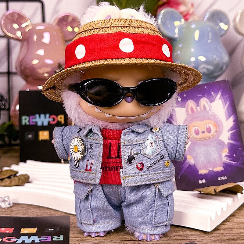 ZoDoll’s Labubu Cool Street Denim Jacket Outfit Set, featuring a straw hat and sunglasses, poses in front of vibrant decorations and cards, channeling urban streetwear style.