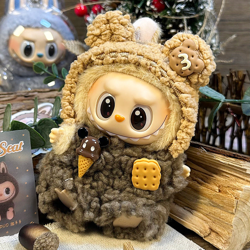 The ZoDoll Labubu Cookie Bear Fluffy Plush Onesie features a small doll with big eyes in a brown teddy hoodie, decorated with cookie, cracker, and ice cream accents—a kawaii collectible for any fan.