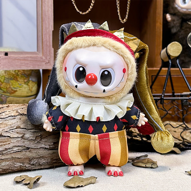 The ZoDoll Labubu Circus Clown Harlequin doll wears a velvet jester hat, ruffled collar, and colorful costume inspired by miniature theater art, standing on a wooden surface with a painted face and red nose.