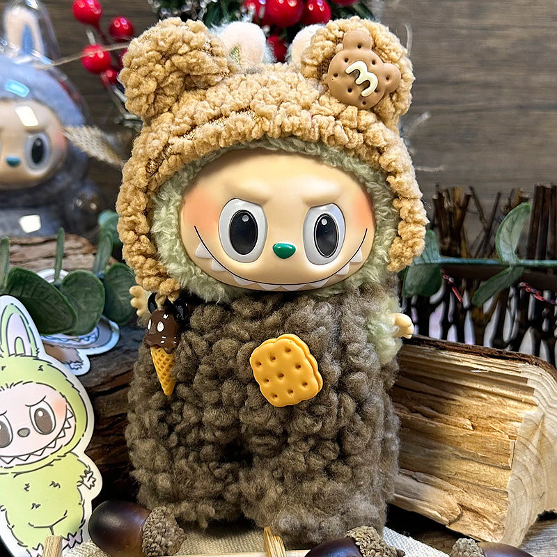 The ZoDoll Labubu Cookie Bear Fluffy Plush Onesie features a mischievous doll with big eyes, wearing a brown teddy hoodie with cookie and ice cream accents—an adorable collectible for any kawaii fan.