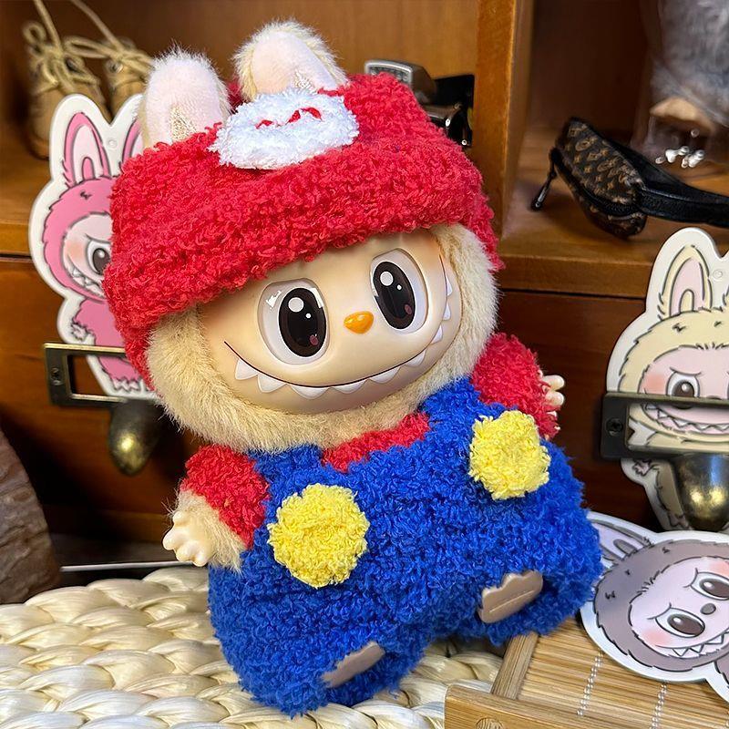 The ZoDoll Labubu Fluffy Plumber Costume Set, featuring a red cap and blue overalls, sits among cartoon-style character cutouts.