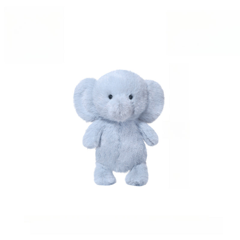 The JOOKI 23cm Blue Elephant Plush Toy, featuring big ears and a cute face, stands upright against a white background—perfect for baby gifts and stuffed animal collectors.