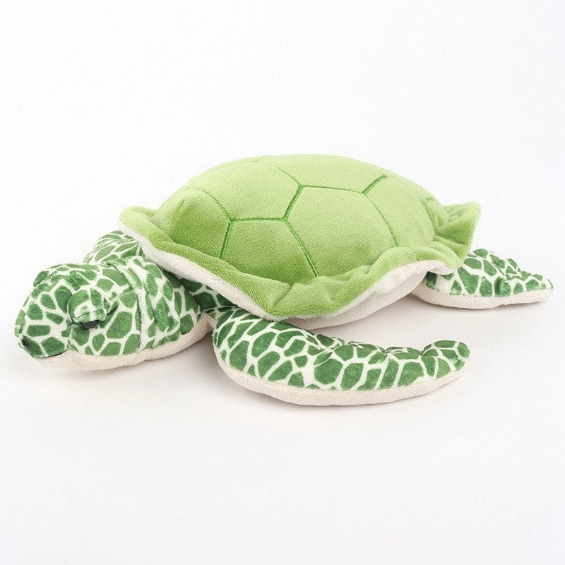 The ZoDoll Sea Turtle Plush Toy is a green and white stuffed animal pillow (25x30cm) with a hexagonal shell pattern and textured flippers, displayed on a plain white background.