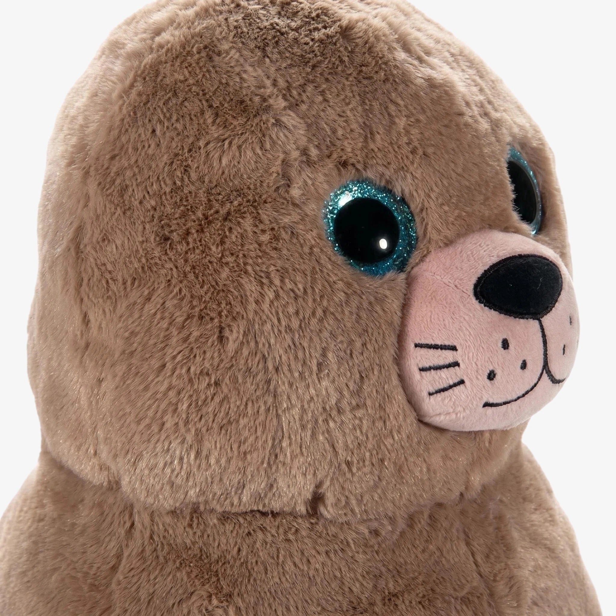 The ZoDoll Chonkers Sea Lion Plush is a 15-inch brown Steller sea lion with large blue glittery eyes, a pink snout, and stitched whiskers—an adorable PIER 39 San Francisco-inspired keepsake.